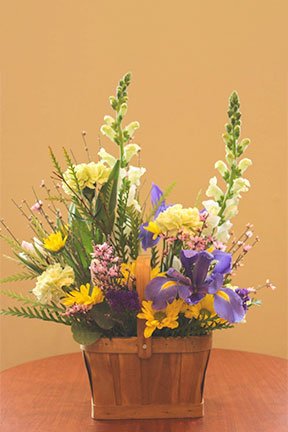 assorted flowers in a basket