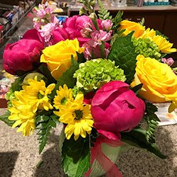 Hot pink peonies and yellow flower arrangement