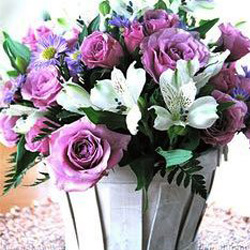 pink roses and white lilies in white wooden basket