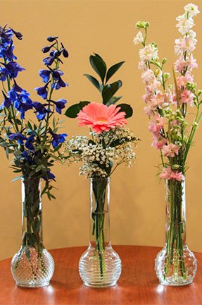 3 vases with assorted flowers