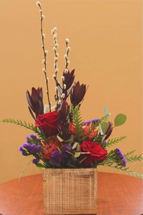 assorted flowers in a basket